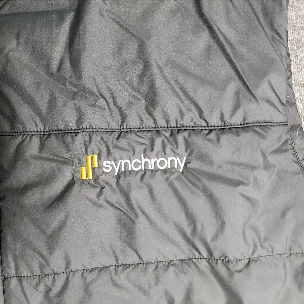 Premium insulated puffer vest by The North Face featuring embroidered Synchrony